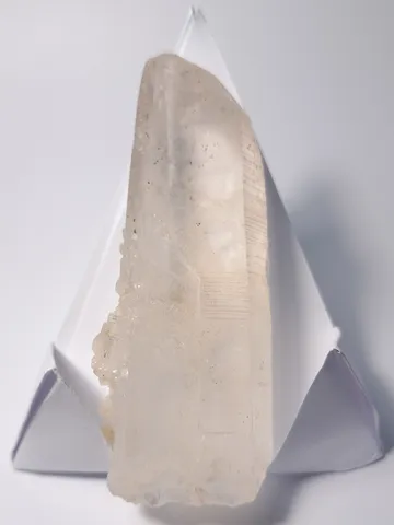 A large clear quartz too large to stand upright